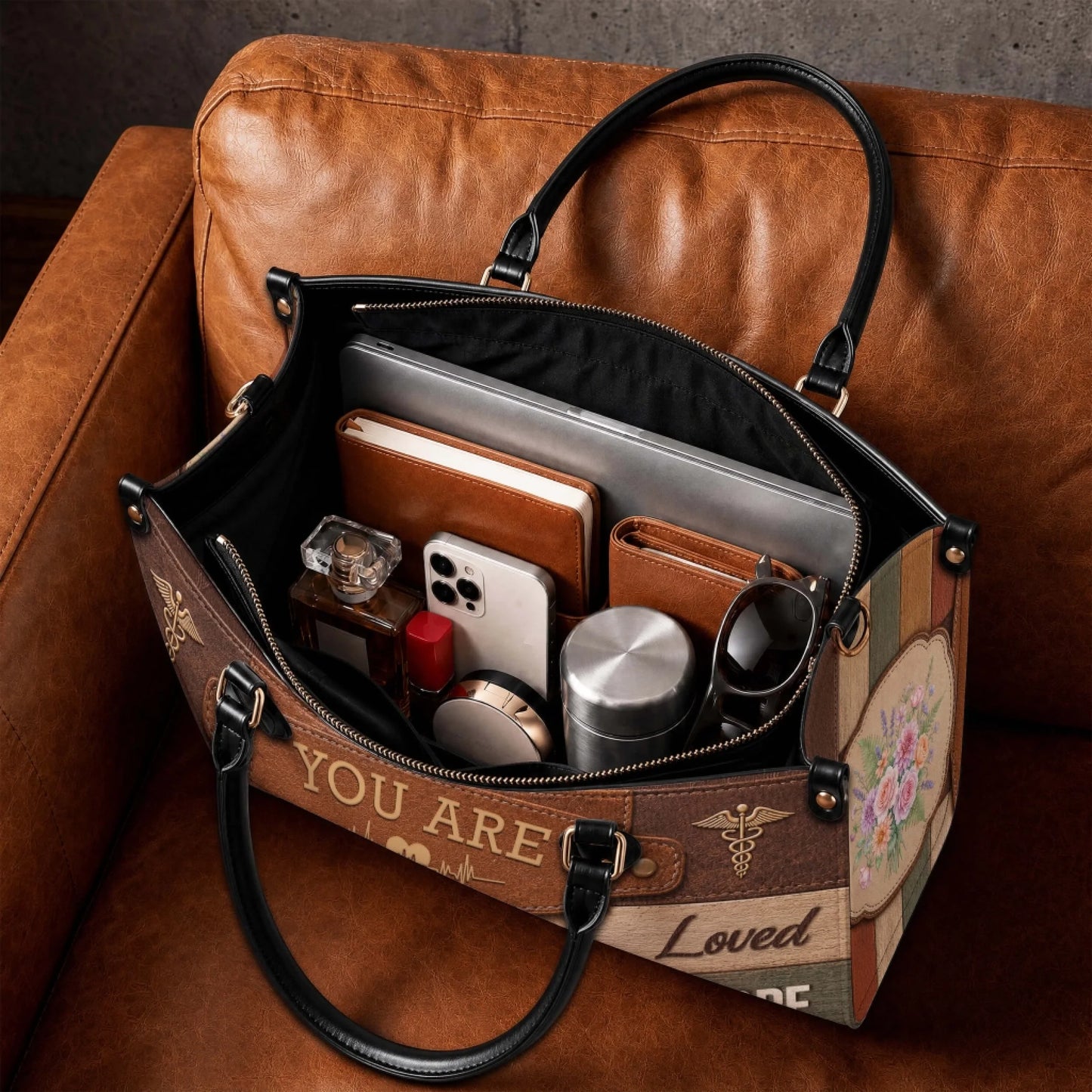 Spacious interior of a stylish personalized nurse handbag showing room for a laptop notebook phone and everyday essentials.
