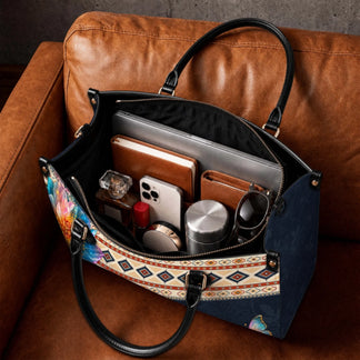 Interior view of personalized handbag filled with daily essentials including laptop notebook and personal items