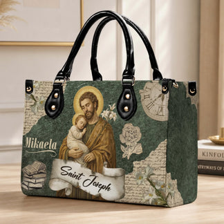 Personalized leather handbag featuring a vintage Saint Joseph and Child illustration with custom name Mikaela print.
