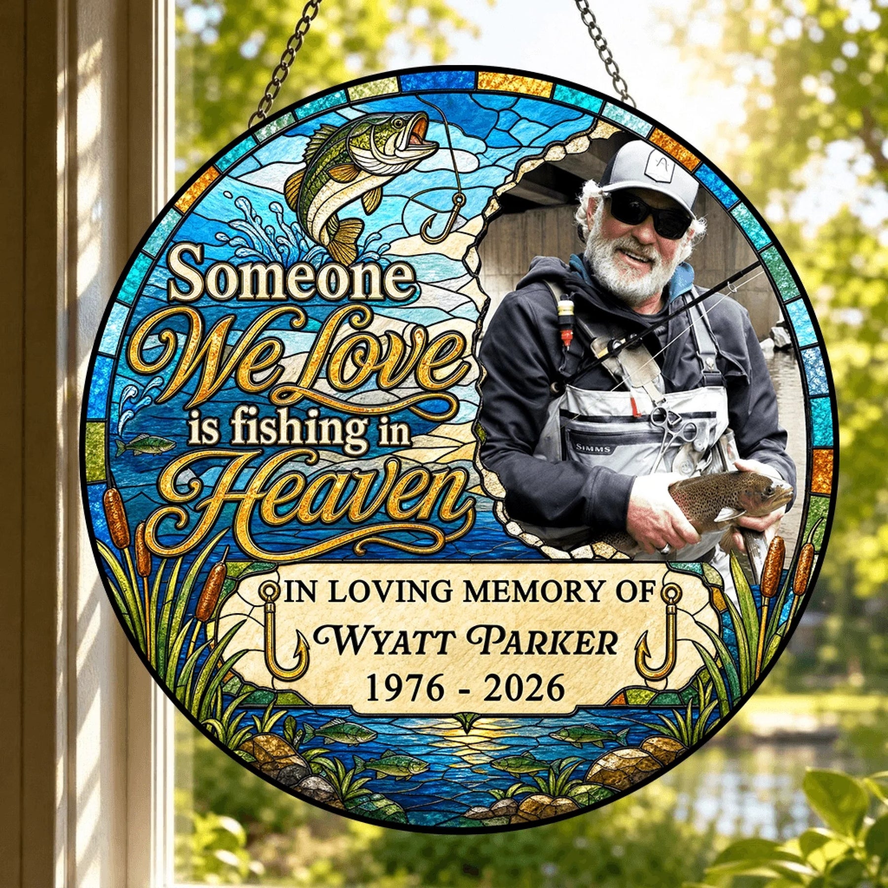 Decorative round stained-glass window hanging for memorial, featuring a personalized tribute to a fisherman.