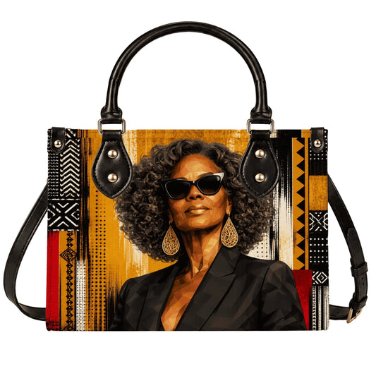 This stylish shoulder bag features a striking art print of a sophisticated African American woman in sunglasses and gold accessories.