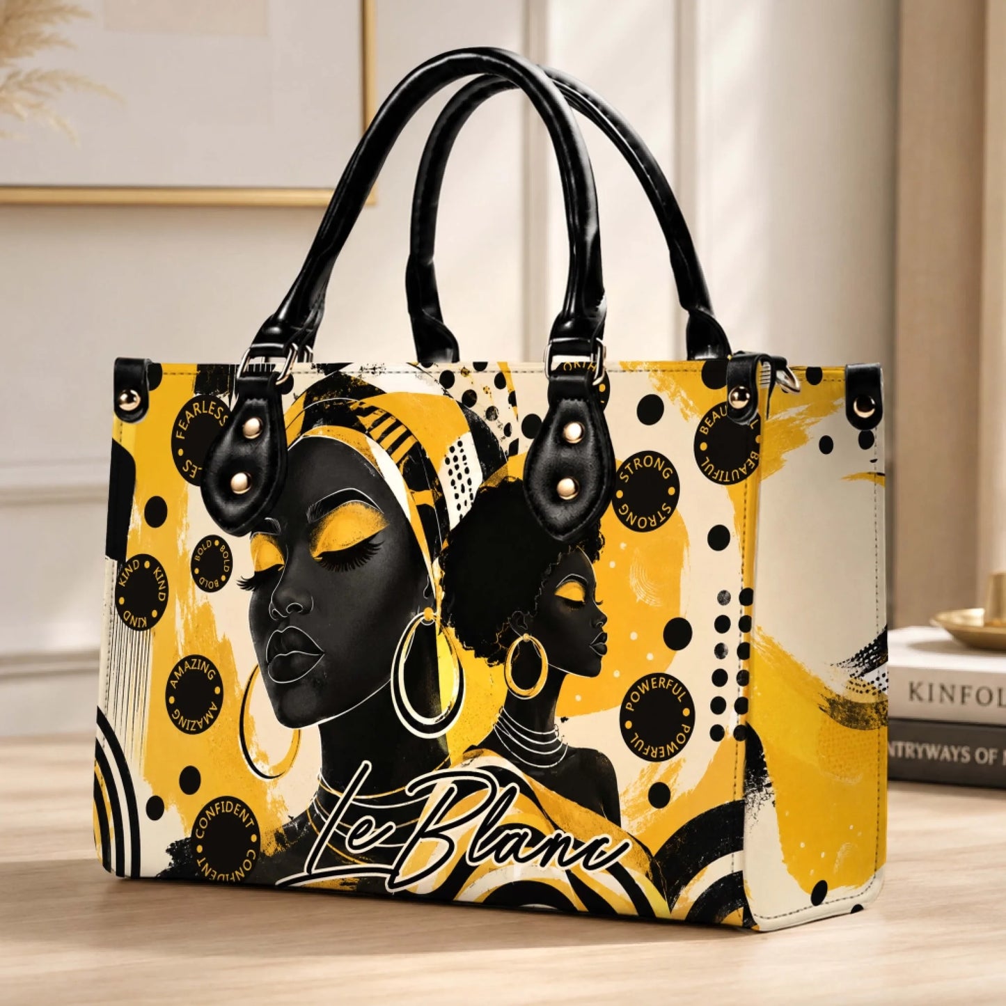 Fashion shoulder bag featuring artistic portraits of black women and motivational words in a chic yellow and black theme