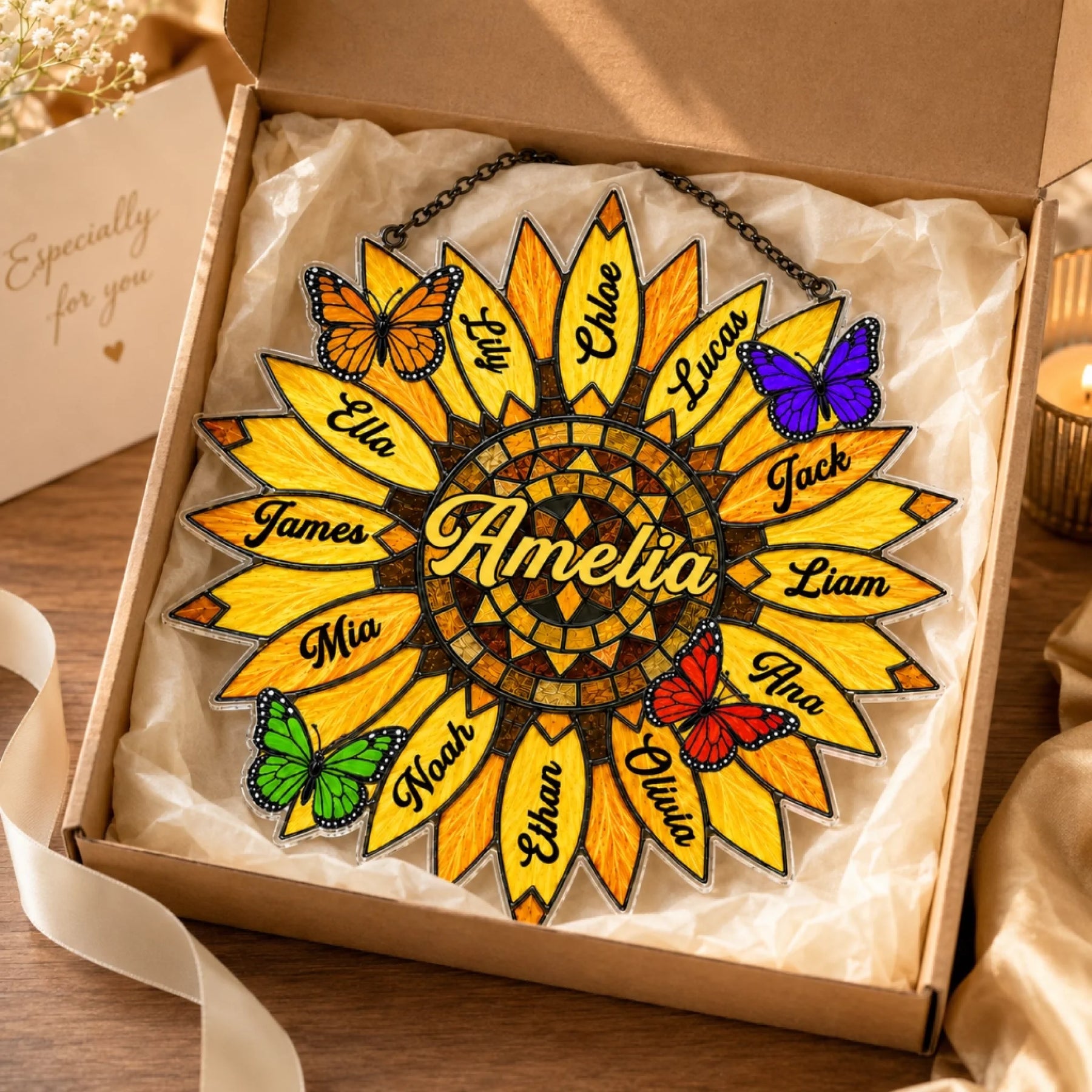 Sunflower-shaped decorative item with names and butterflies in a gift box