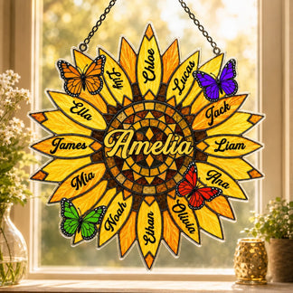 Decorative sunflower-shaped nameplate with butterflies on a window sill.