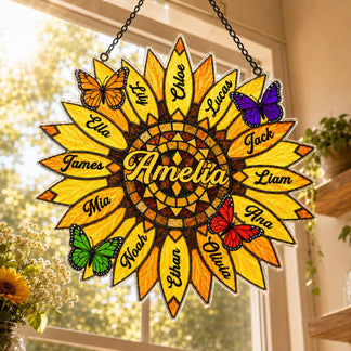 Decorative sunflower-shaped wall hanging with names and butterflies on a window background