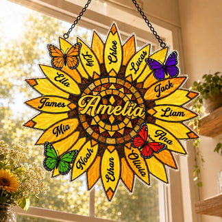 Decorative sunflower-shaped wall hanging with names and butterflies on a window background