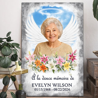 Tableau commémoratif personnalisé avec photo d'une femme, ailes d'ange et fleurs pour un hommage en douce mémoire.