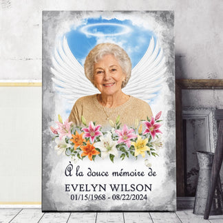 Toile personnalisée avec photo, ailes d'ange et lys colorés pour commémorer la vie d'un proche.