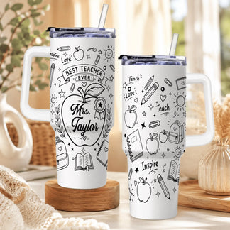Two white teacher tumblers with handles, displayed on a wooden stand with school supply doodle artwork.