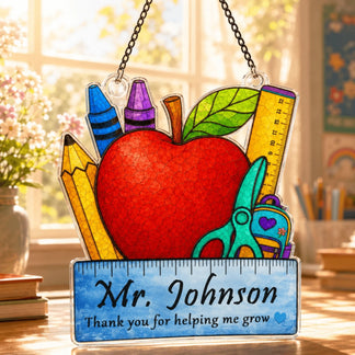 Stained glass-style teacher suncatcher with apple and school supply design