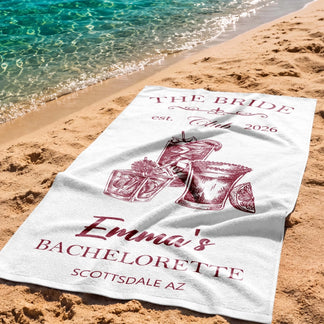 Personalized bachelorette beach towel for The Bride in Scottsdale AZ featuring festive cocktail illustrations.