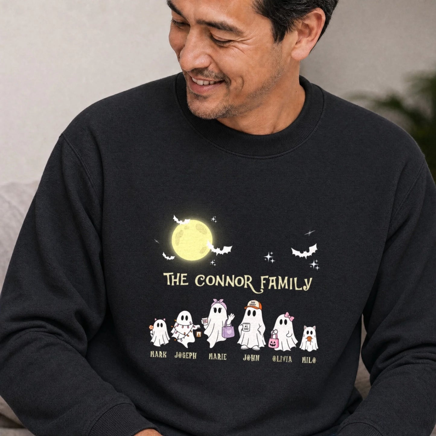 Black Halloween crewneck sweatshirt personalized with ghost characters and family names for a fun spooky season gift.