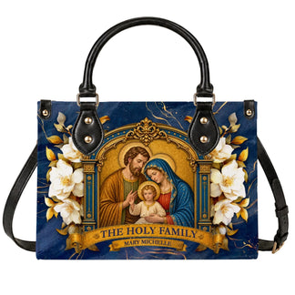 A personalized PU leather handbag featuring The Holy Family artwork, elegant floral details, and custom name text.