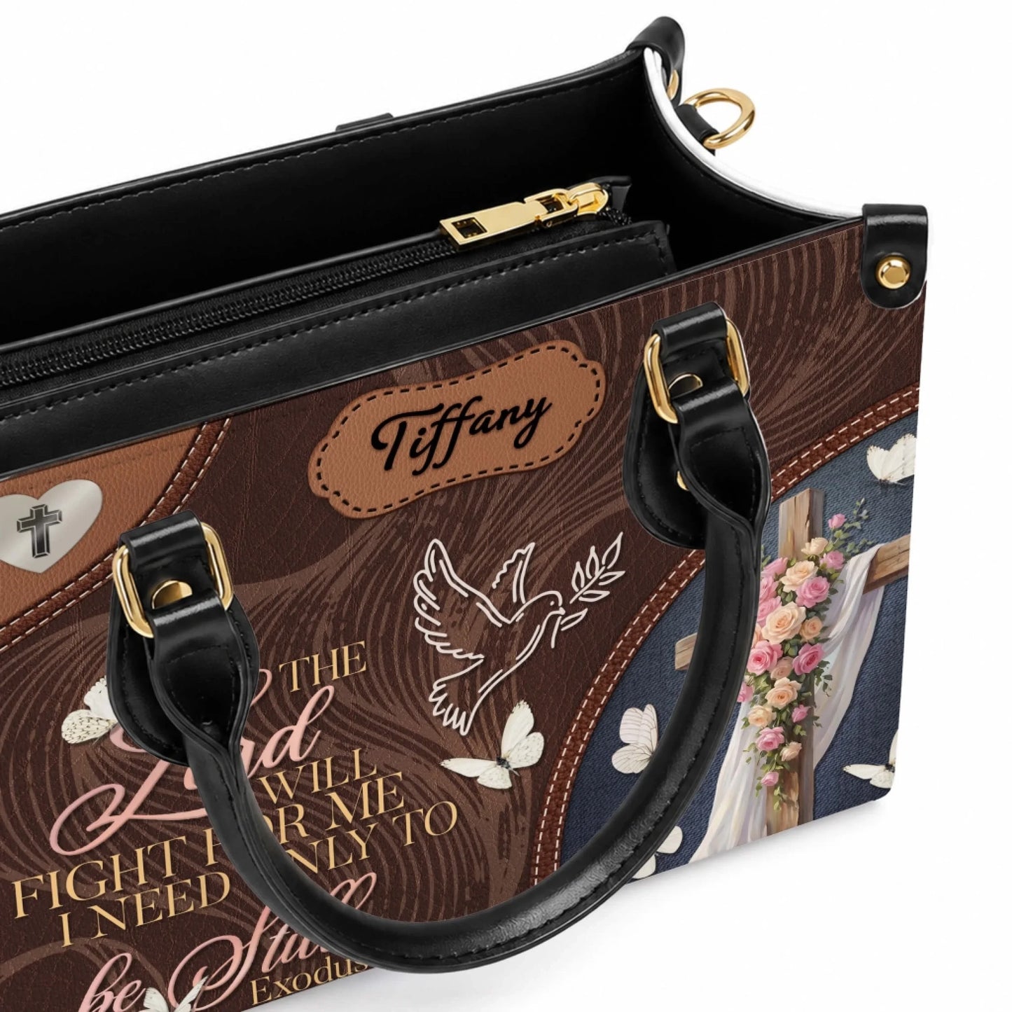 Close up of personalized floral cross leather handbag with custom Tiffany name label and gold hardware details