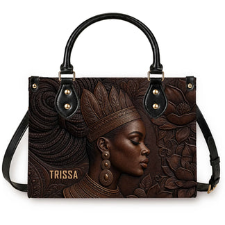 A stylish PU leather handbag featuring a beautiful embossed portrait of an African American woman with a crown.