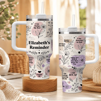 Two floral tumblers side-by-side with inspirational text like I Am Powerful As Hell and Elizabeth's Reminder.