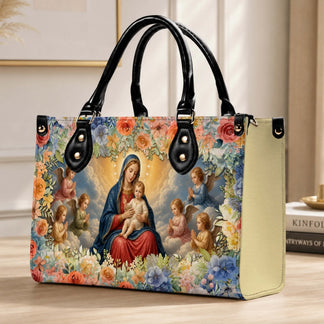 A beautiful PU leather handbag featuring the Virgin Mary and baby Jesus with angels surrounded by colorful flowers.