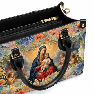 Elegant PU leather handbag showing a religious scene with the Virgin Mary and baby Jesus inside a floral frame.