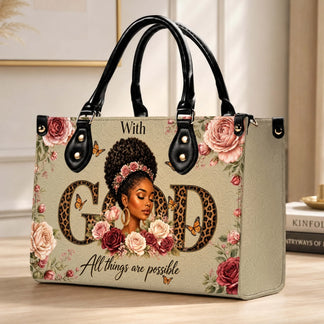 Beige tote bag with black handles, artistic illustration of a black woman, roses, butterflies, and faith-based quote.