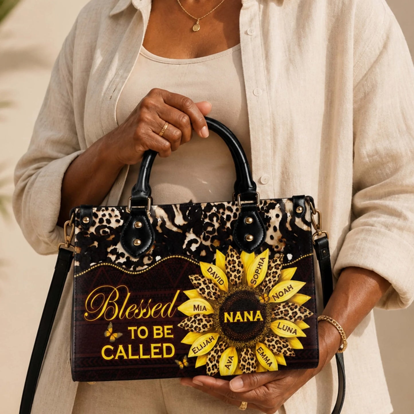 A woman holding a custom leopard print sunflower handbag with Nana and family names, a thoughtful gift for grandmothers.