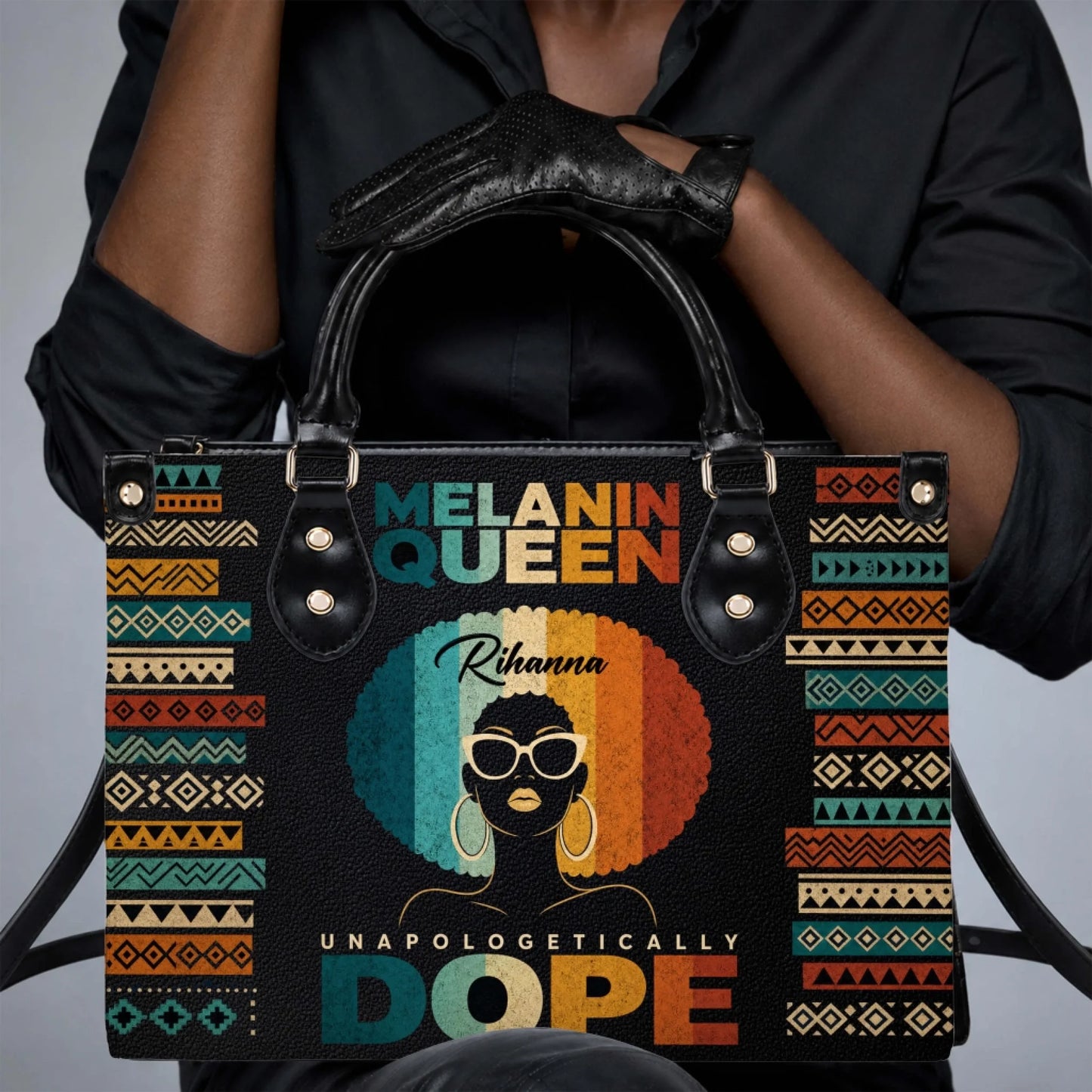 A woman holding a personalized Melanin Queen handbag with vintage style afro art and bold text, perfect for daily use.