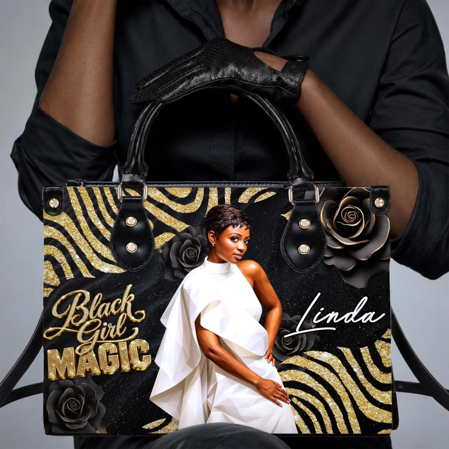 Stylish woman holding a personalized Black Girl Magic handbag with custom name Linda and elegant floral gold design.