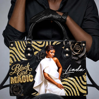 Stylish woman holding a personalized Black Girl Magic handbag with custom name Linda and elegant floral gold design.