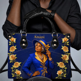 Elegant lady holding a custom blue handbag with gold rose accents and personalized Amani name design.