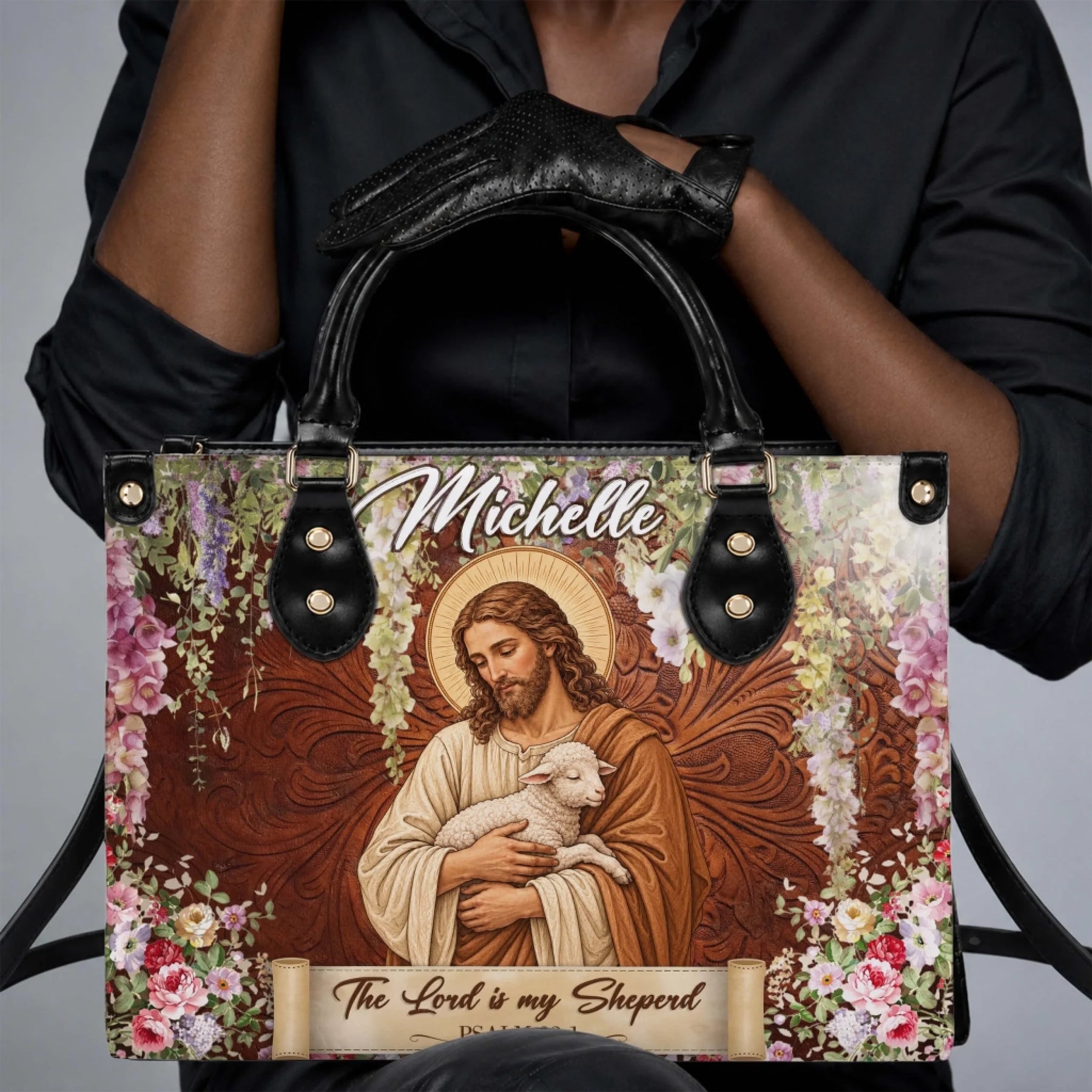 A woman carrying a custom handbag with a Jesus shepherd design and the name Michelle, ideal for daily faith-inspired style.