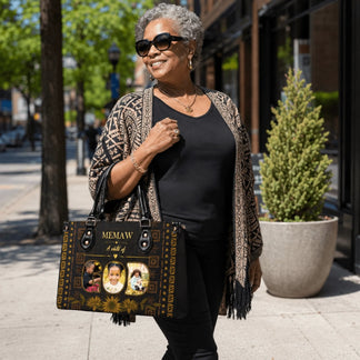 A woman styled with a personalized Memaw handbag featuring custom family photos and elegant gold accent patterns
