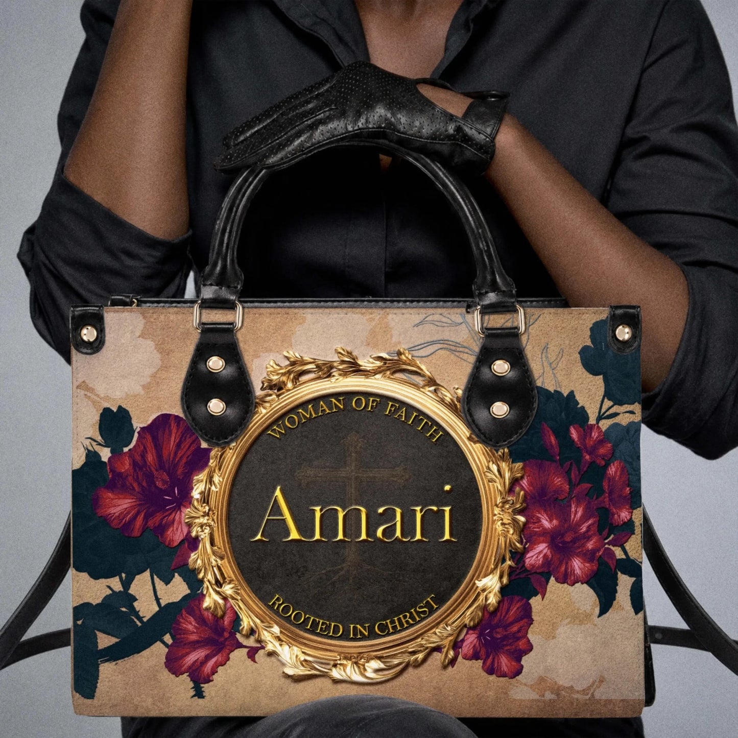 Stylish custom handbag held by a woman, featuring the name Amari with inspirational faith text and floral art.