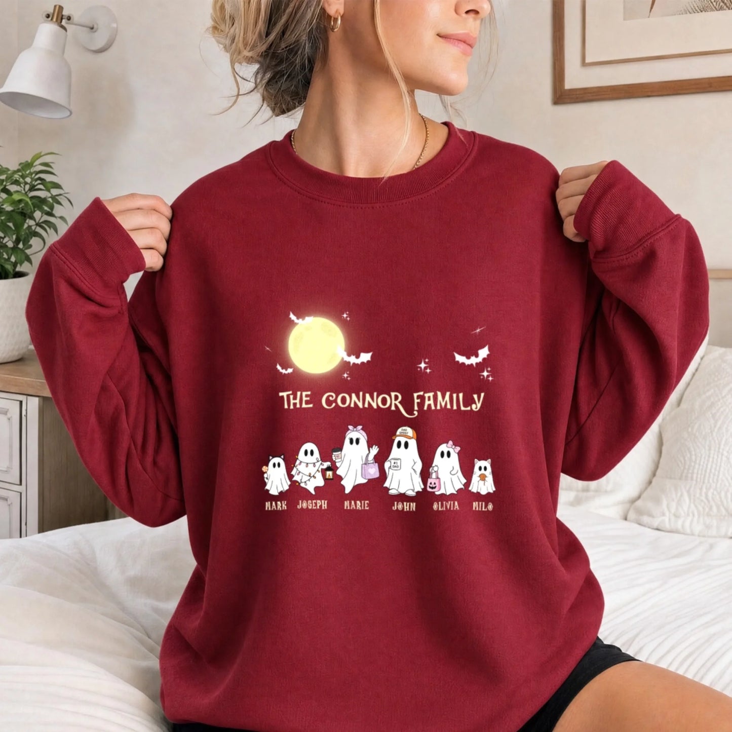 Red personalized Halloween sweatshirt for women featuring cute ghost family characters and custom names for the season.