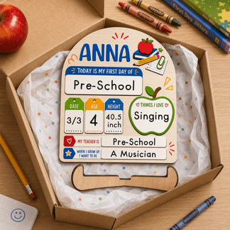 Personalized wooden first day of school milestone sign packaged as a gift, perfect for a preschool student.