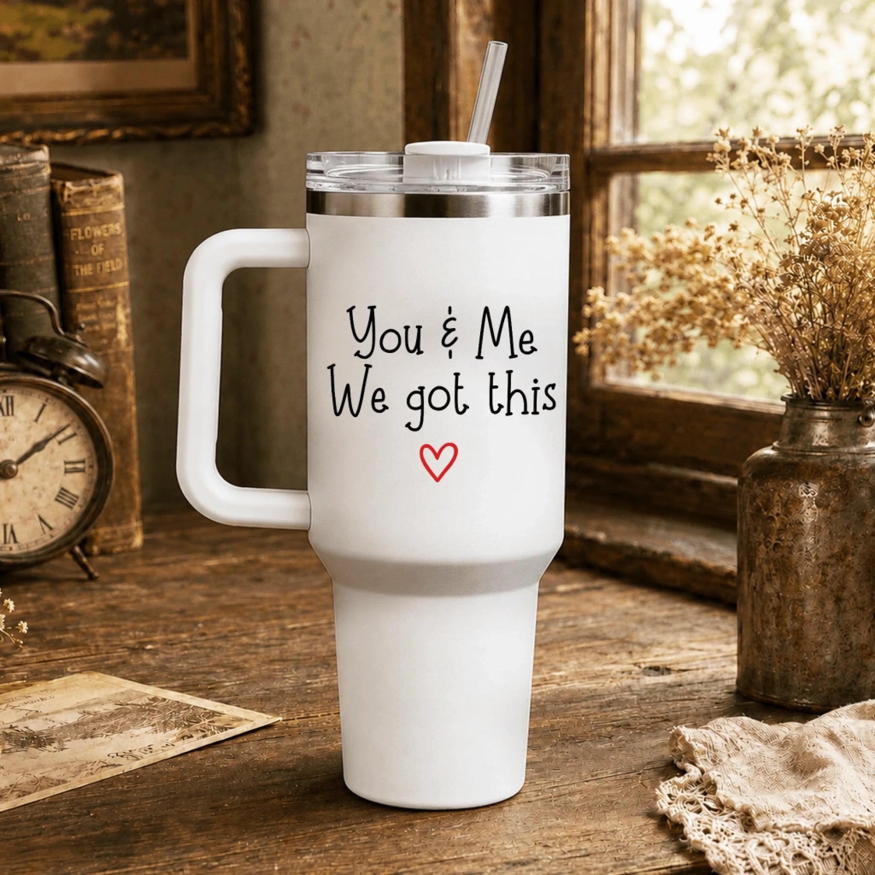 Personalized white tumbler printed with the encouraging quote You and Me We got this and a red heart.